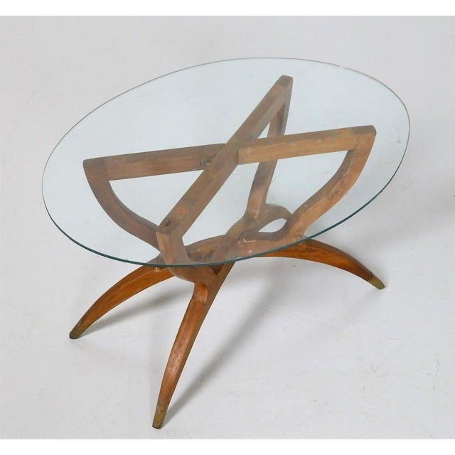 Vintage coffee table is a piece of original design furniture realized in the 1950s by Italian manufacture, from cut...