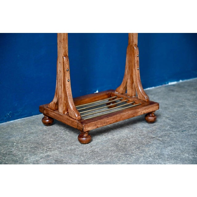 What a beautiful evening companion this antique valet stand is! Made of solid wood and gilt brass, it captivates at first...