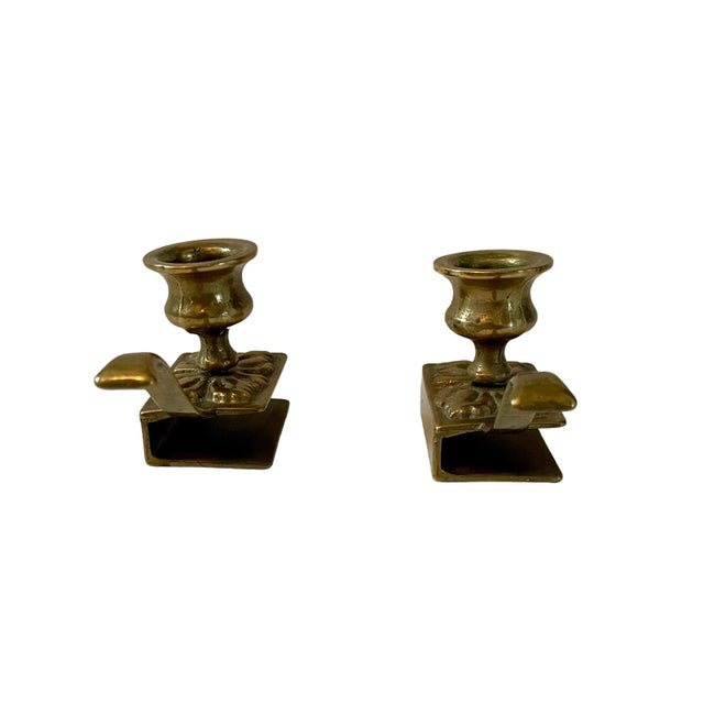 This antique-style brass candle holder is a beautiful addition to any collection. The item is made of brass and has an...