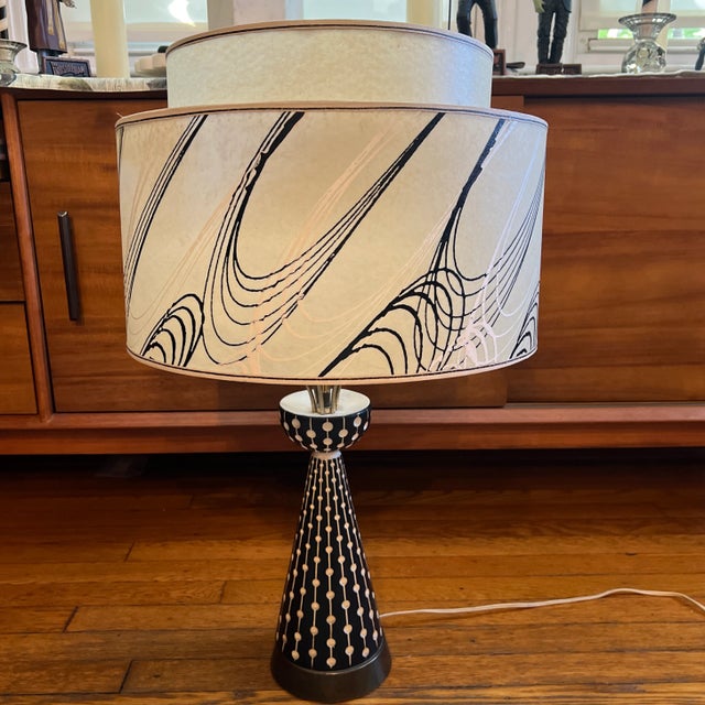 Hard to find original chalk-ware mid-century modern lamp. Black base with low relief sgraffito dot and linear pattern....