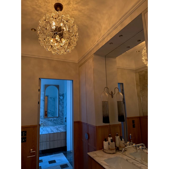 Bold, elegant italian floral space age murano chandelier. Ball formed eclectic sputnik murano glass chandelier. This...