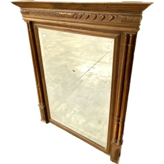 This mirror is a stately, French, carved oak, rectangular overmantle, with a heavy influence of symmetry in the Henry II...
