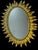 Large oval sun mirror in wrought iron from the 1950s. Italian artisanal fabrication, decor of leaves.