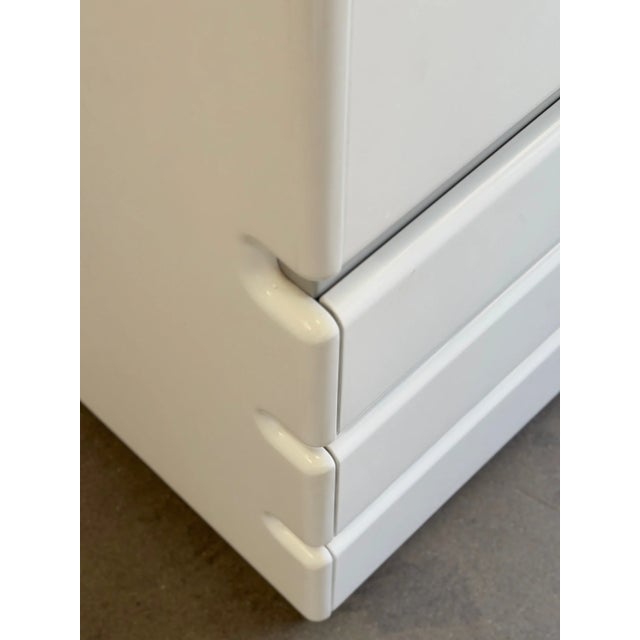W39 D21.25 H74 Separated in two segments with different types of storage. Top segment features two doors that open out...
