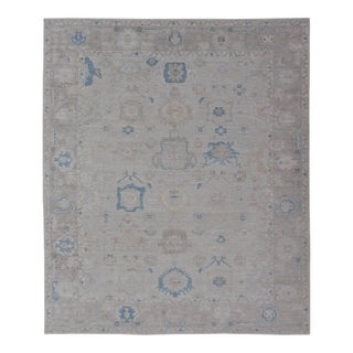 Modern Tribal Oushak With Light Taupe Colored Border and Off White Background For Sale