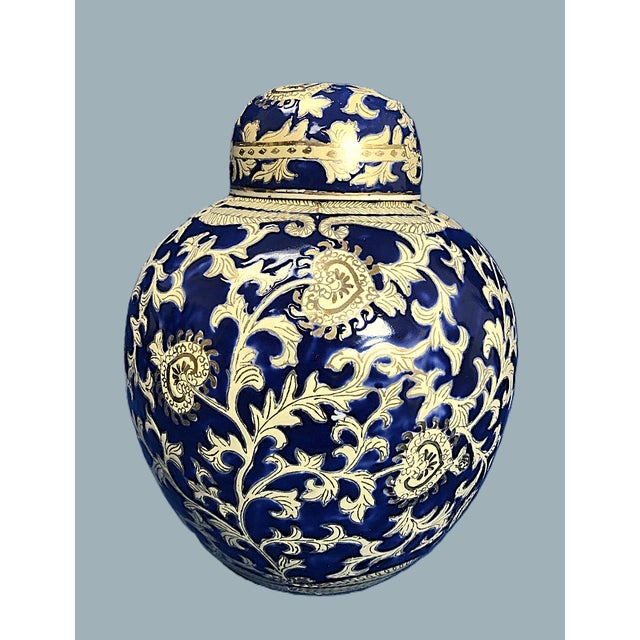 Midnight Bloom Ginger Jar with Lid – 13” The blue and gold swirl design is a traditional Chinese style that is both unique...