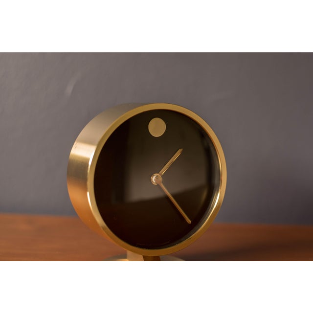 Vintage Howard Miller museum clock originally designed by Nathan George Horwitt. This piece has a brass finish with a...