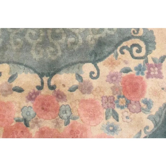 Oval Art Deco Chinese rug in original good condition. The rug is in green, rose and beige shades. -condition: original...
