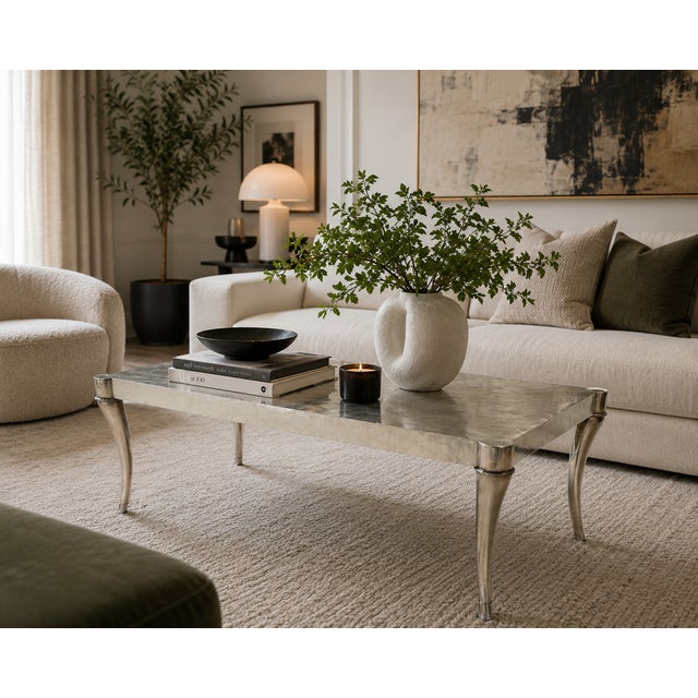 An elegant and sophisticated coffee table by renowned high-end furniture maker Ferguson Copeland. This striking piece...
