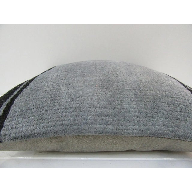 This is a pillow cover made from a vintage kilim rug. The piece was properly washed and ready to use. Pillow inserts not...