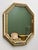 A striking 1980s faux-bamboo mirror with a warm gilt wooden frame and beautifully faceted mirrored panels. The octagonal...