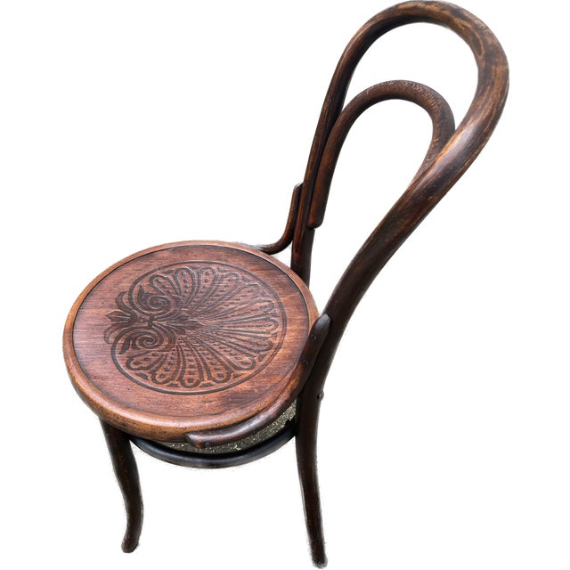 This is a bentwood chair attributed to Thonet, in the style of the #14 bistro chair with diagonal braces. Made in Poland...