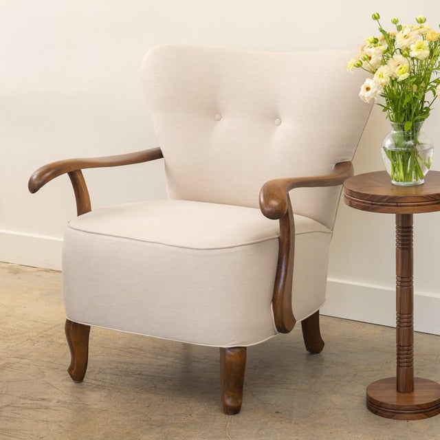 Incredible pair of upholstered armchairs from France, 1930's. Newly upholstered in a creamy linen with button detail....