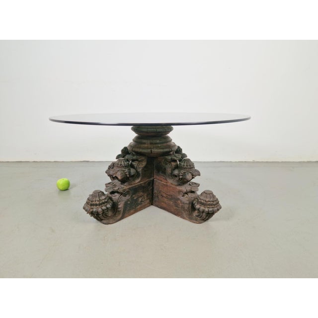 Anglo-Indian solid hardwood hand-carved coffee table Circa 1890, with glass top. Intriguing Anglo-Indian pedestal expertly...