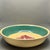 • This rare yellowware serving bowl features the hand-painted Cross Hatch Pansy pattern with its signature teal-green band...