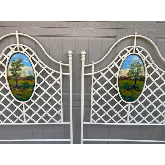 Hand painted landscape scenes grace the fronts of these very heavy iron headboards. I would love to decorate an entire...
