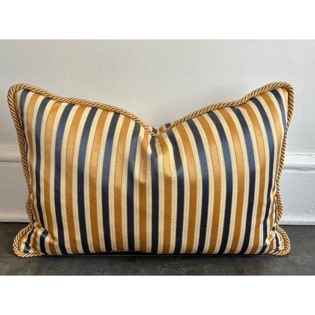 Handsome striped blue and gold lumbar pillow with a cord edging. Down-filled with a zipper opening. Please see condition...