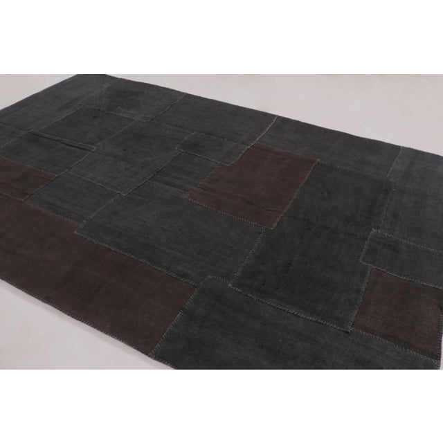 Handwoven in hemp circa 1950–1960, this 7x10 vintage Anatolian patchwork rug is a sophisticated addition to Rug & Kilim’s...