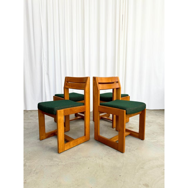 This set of four sleigh chairs from Maison Regain is ready to grace your dining room. Their solid elm frame, with its...