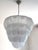 Luxury modern Chromed chandelier with clear “Petals” in Murano glass with transparent "graniglia" that add more...