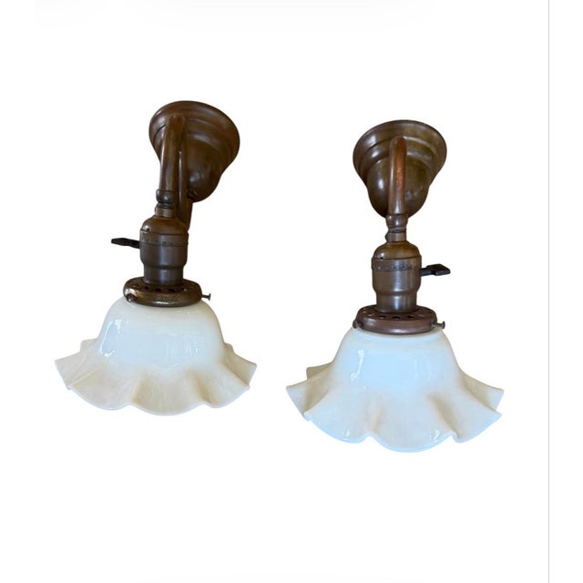 This pair of rare antique wall sconces are great in bathrooms, used as art lights, in bedrooms or kitchens. Stunning down...