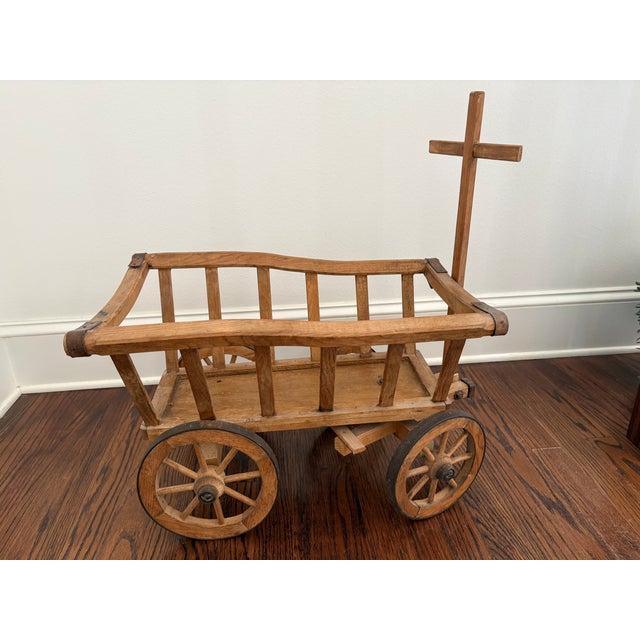This primitive antique pine cart measures 22" long x 14" wide x 15" high. With the handle down it is 42". It is perfect...