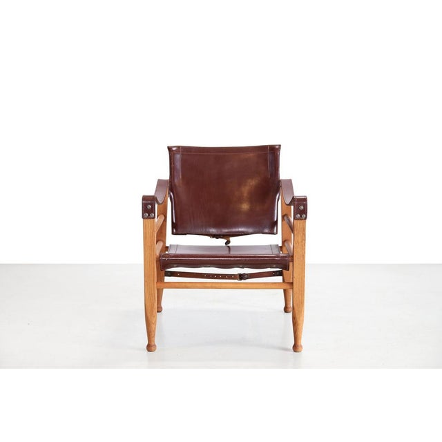 Very beautiful vintage Safari Aage Brun produced by Aage Bruun & Son in Denmark. This model is made of solid oak and...