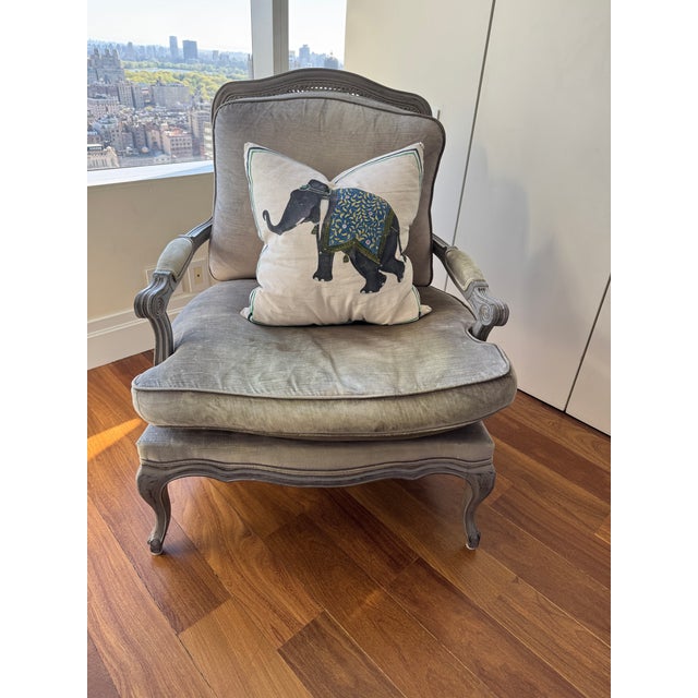 This stunning oversized bergère chair combines classic French Provincial elegance with a relaxed, lived-in charm. The...