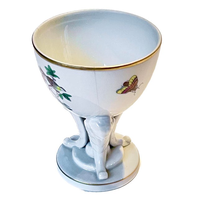 Vintage Herend Rothschild porcelain cherub egg cup. Handpainted birds in a garden and insects with cherub base & support...