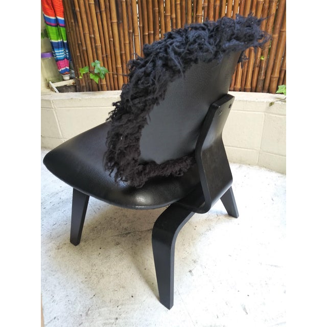 The Eames Cafe Fur Lounge Chair is a great design for any interior space. Produced from a formed solid wood frame finished...