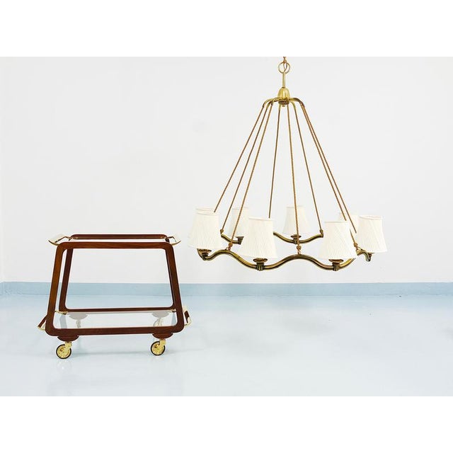 This exquisite and large art nouveau / jugendstil brass chandelier exemplifies the elegance of viennese modernism....