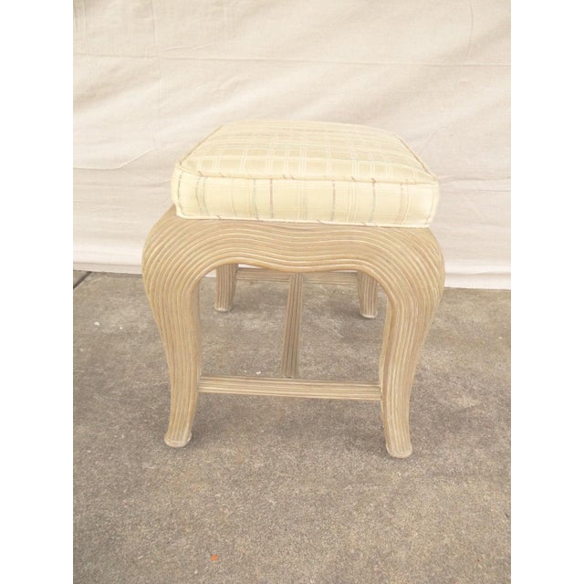 A vintage Regency sculpted wicker footstool. Great shape, tight and sturdy..light wear.