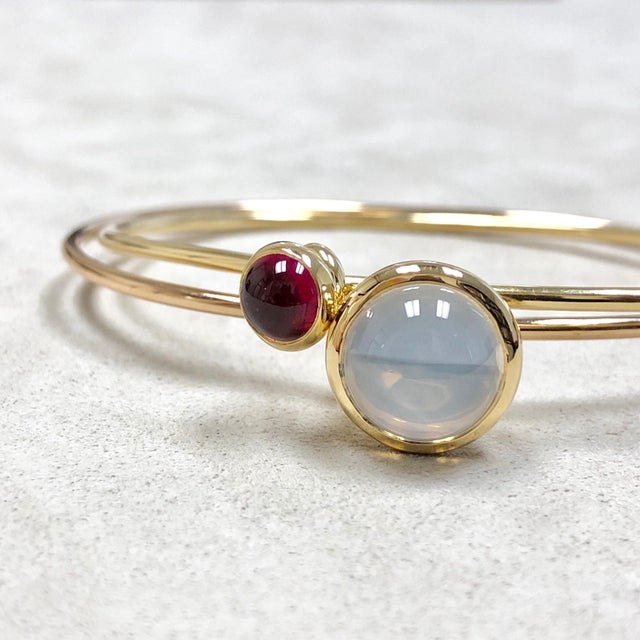 Created in 18 karat yellow gold Moon quartz 7.5 cts approx Rubellite 2 cts approx Openable oval bracelets Bracelet Inside...