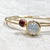 Created in 18 karat yellow gold Moon quartz 7.5 cts approx Rubellite 2 cts approx Openable oval bracelets Bracelet Inside...