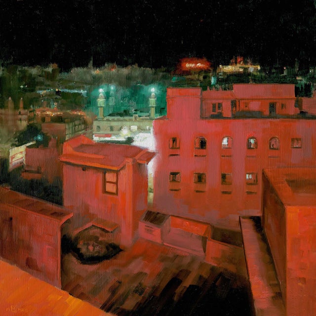 This oil on board painting captures a nighttime view over the city of Madurai, with buildings bathed in warm reds and cool...