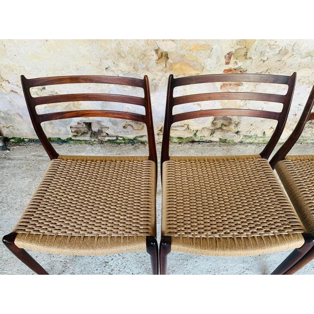 Set of six, mid-century modern, first edition brazilian rosewood dining chairs, with seats made of danish paper cord,...