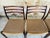Set of six, mid-century modern, first edition rosewood dining chairs, with seats made of danish paper cord, designed by...