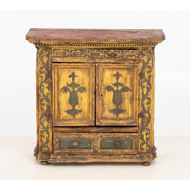 Continental Paint-Decorated Small Cabinet, with two-door compartment between two drawers. 27" H x 27.75" W x 13.5" D....