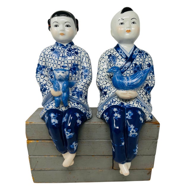 A truly exceptional, flawless pair of vintage 1980s Chinoiserie porcelain shelf sitters decorated in striking, high-...