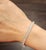 This stunning tennis bracelet embodies modern sophistication, crafted to captivate with its sleek design. Adorned with 70...