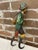 The Black Forest or Bavarian folk art whip holder is a hand painted bearded man with a pipe in his hand. He is carrying a...
