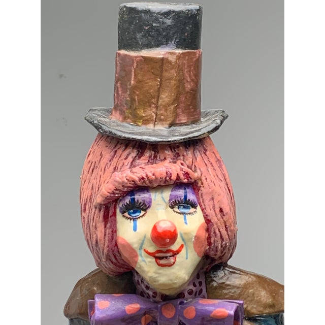 A unique signed and numbered piece by Oskar Raoul, featuring a 24" tall paper mache clown. Raoul is known for his artistry...