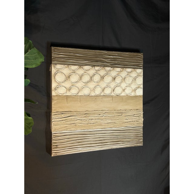 Modern textured abstract wall art featuring neutral brown, beige, taupe, cream, and earthy gray tones. The raised circular...