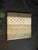 Modern textured abstract wall art featuring neutral brown, beige, taupe, cream, and earthy gray tones. The raised circular...