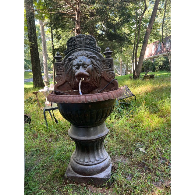 Antique Neoclassical Style Cast Iron Lion Mask Urn-Form Garden Wall Fountain Feature the shaped top with foliate and...