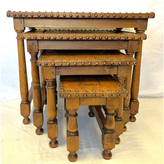 Great rustic set of four Spanish Revival style nesting tables from the mid 20th century. They are made of solid wood with...