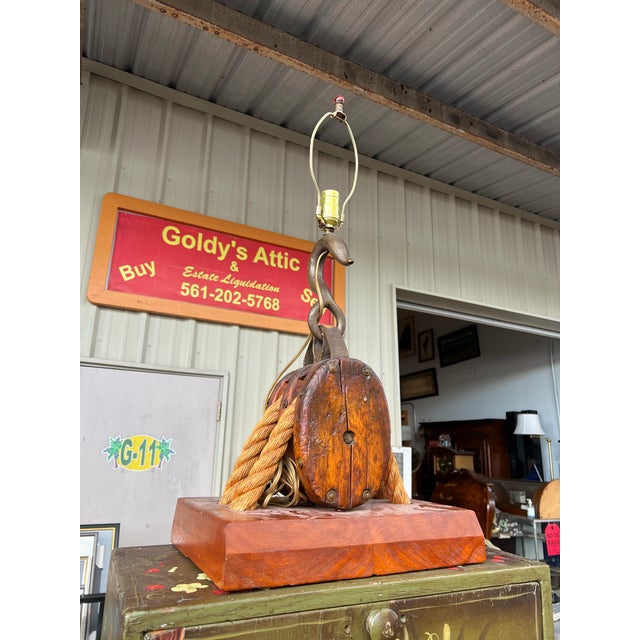 Vintage industrial Marine Pully Block Lamp. A copper metal circle plate has a star with Boston and Lockport Block company...