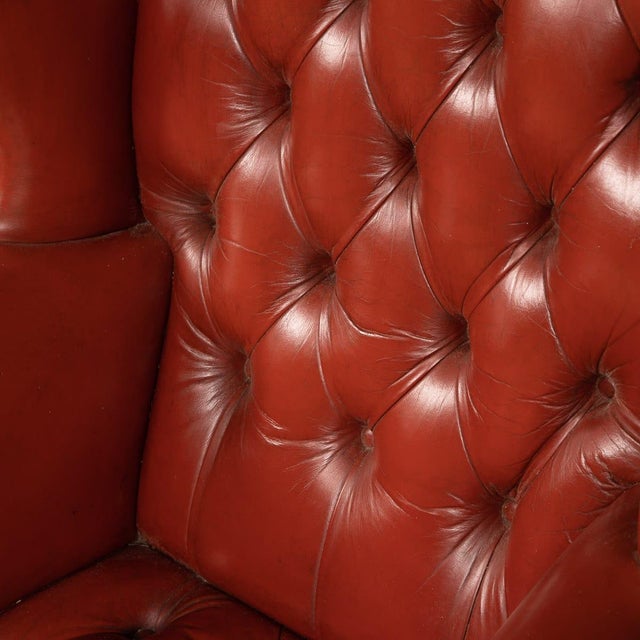 A truly stunning example of English leather craftsmanship, these leather wing-back armchairs have an exceptionally rare...