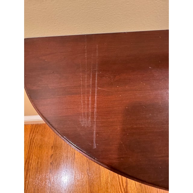 This is a vintage piece from the Ethan Allen Medallion Collection. This console table has three elegant, slender taper...