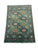 This naturally dyed wool Kazak rug has a vivid turquoise field filled with repeating medallions in burgundy, golden...